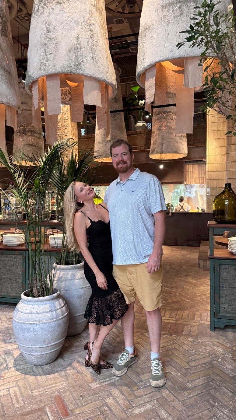 Seth and Maiia Church at dinner